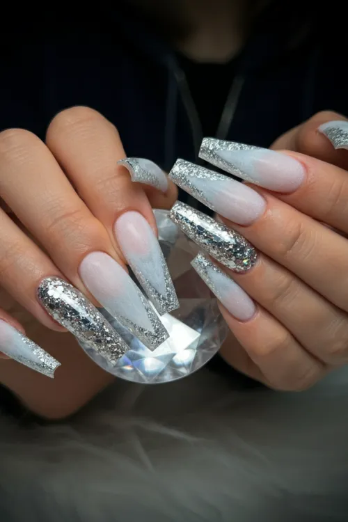 Elegant 10 coffin winter nails featuring sparkling snowflakes, metallic accents, and festive designs for the perfect winter look.